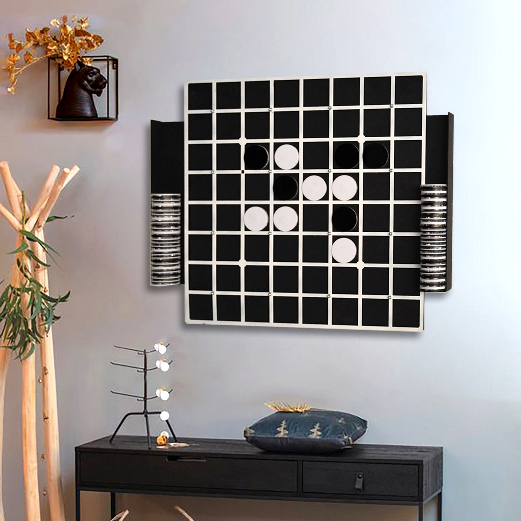 Reversi game board wall mounted with black and white checkers and opponents stones visible with hanging instructions