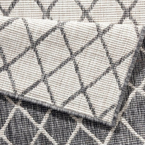 Gray and white woven reversible indoor-outdoor geometric flatweave rug with a diamond pattern