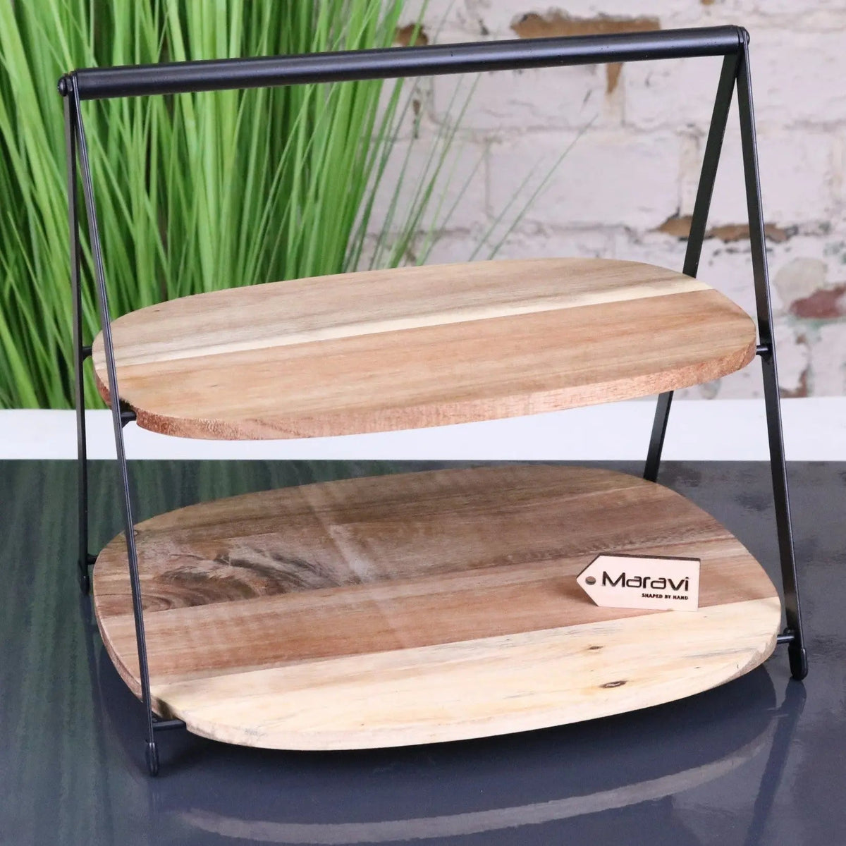 Two-tiered wooden tier cake stand with black metal frame perfect for serving cakes and desserts