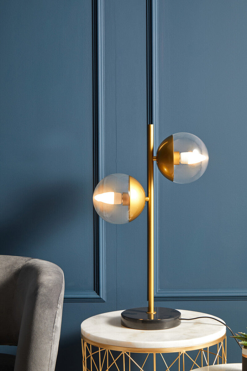 Revive two light gold and black marble table lamp with gold toned spherical glass shades on black marble base
