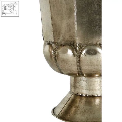 Silver-toned hexagonal metal vase with textured surface and decorative stitching in antique silver finish