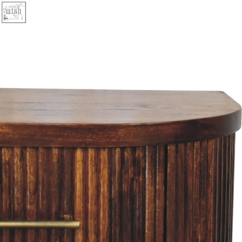 Dark brown wooden ribbed bedside table with brass handles and vertical texture for bedroom use