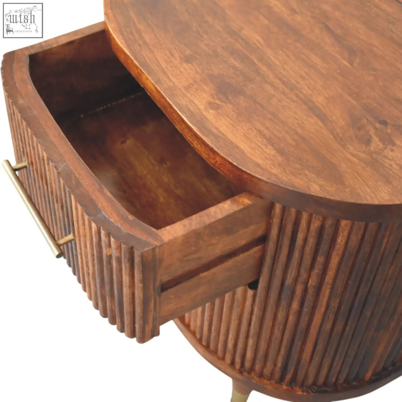 Rich brown wooden ribbed bedside with curved top and brass handles on the drawer for stylish bedroom storage
