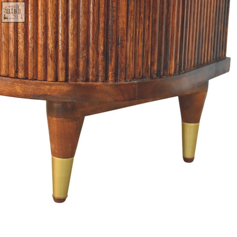 Rustic wooden ribbed bedside with brass handles vertical slats and brass-tipped legs for stylish storage