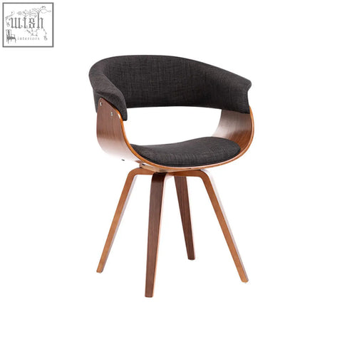 Richie dining chair with a sleek curved wooden frame and dark gray upholstered seat for mid-century modern dining