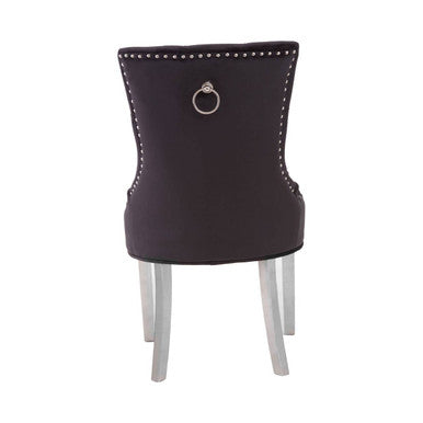 Richmond black velvet dining chair with silver nailhead trim and a central ring pull on the back side