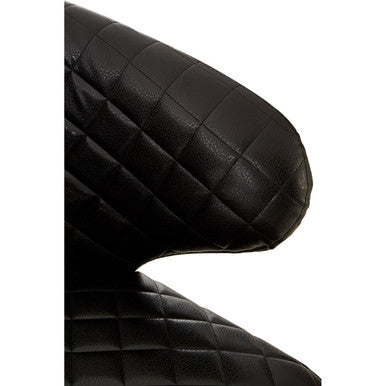 Close-up of richy black leather quilted armrest with diamond stitch on leather effect accent chair