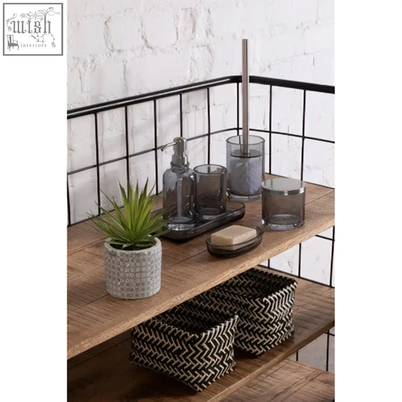 Gray glass soap dish with sleek modern design and metallic pump perfect for stylish glass soap display