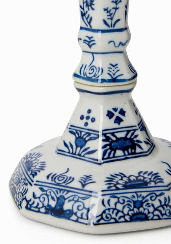 A white ceramic candlestick with intricate blue floral and geometric patterns from rijksmuseum delft blue and white candle holders pair