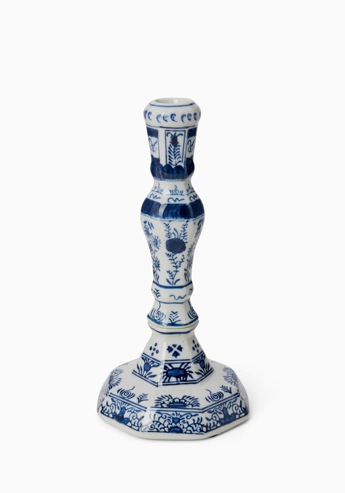 A pair of rijksmuseum delft blue and white ceramic candle holders with intricate floral and geometric patterns