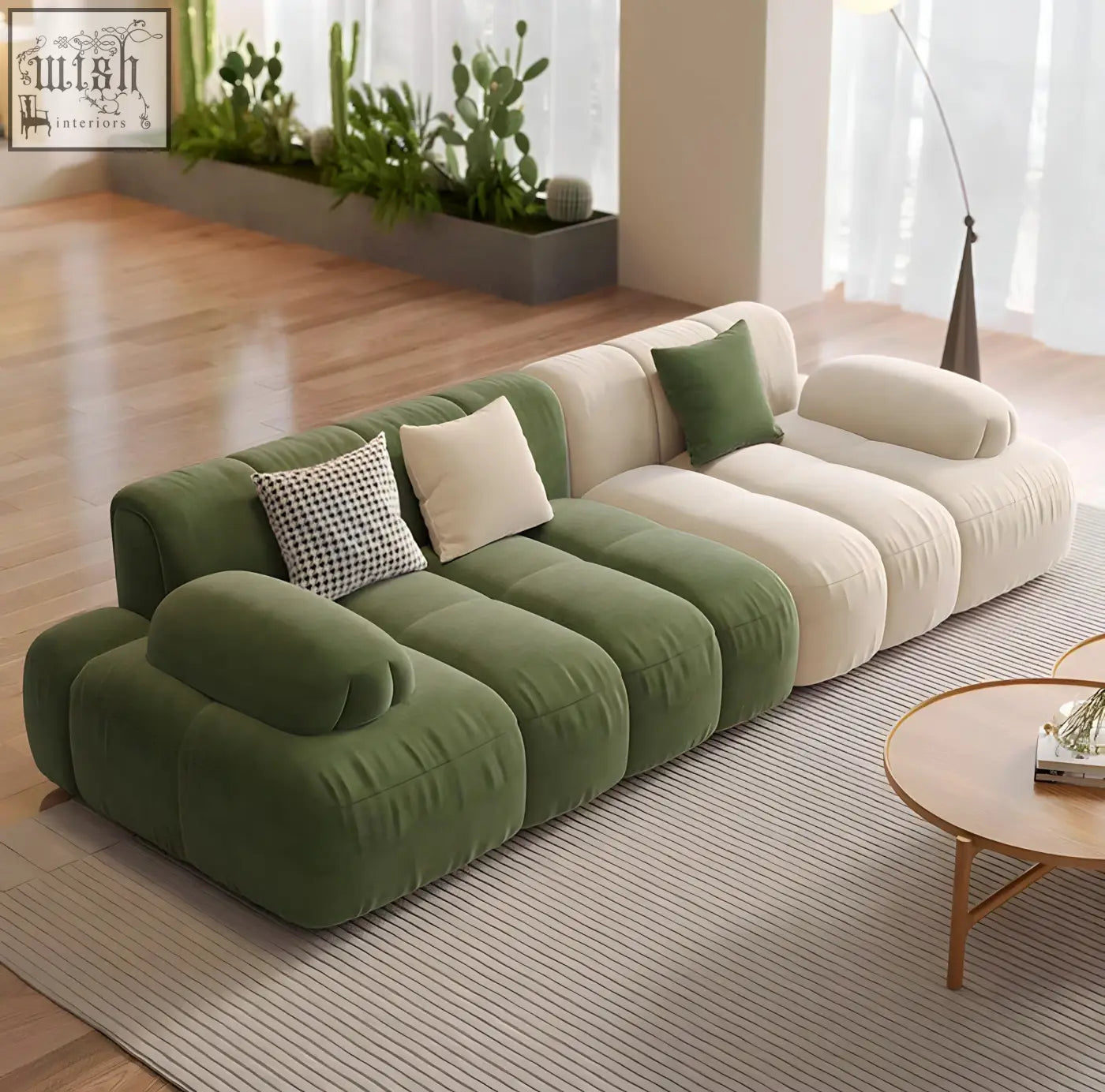 Modern modular riku sofa with plush green and cream velvet sections and patterned throw pillows
