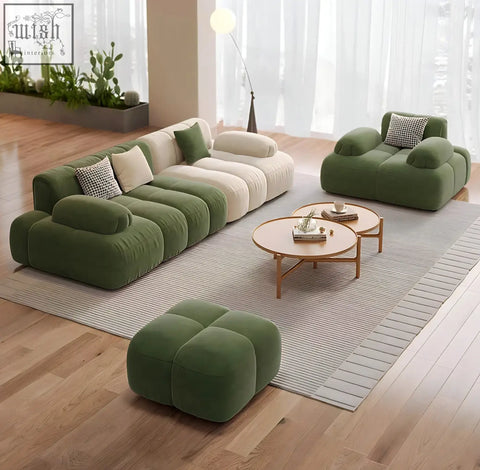 Modern modular sectional riku sofa in soft olive green velvet with cream cushions and matching throw pillows