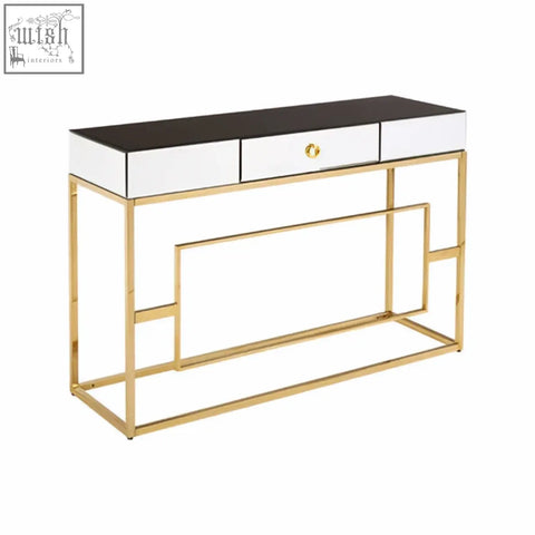 Gold finished metal rimini console table with black and white mirrored top and three drawers for stylish storage