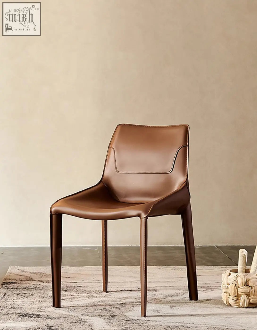 Brown leather dining chair with sleek minimalist design and tapered legs perfect for modern dining room seating
