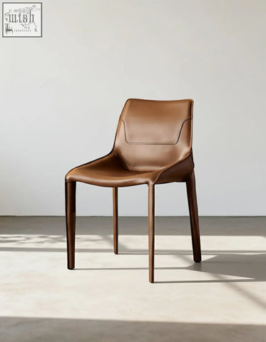 Rinaldi modern dining chair in brown real leather with sleek design and tapered wooden legs for dining room use