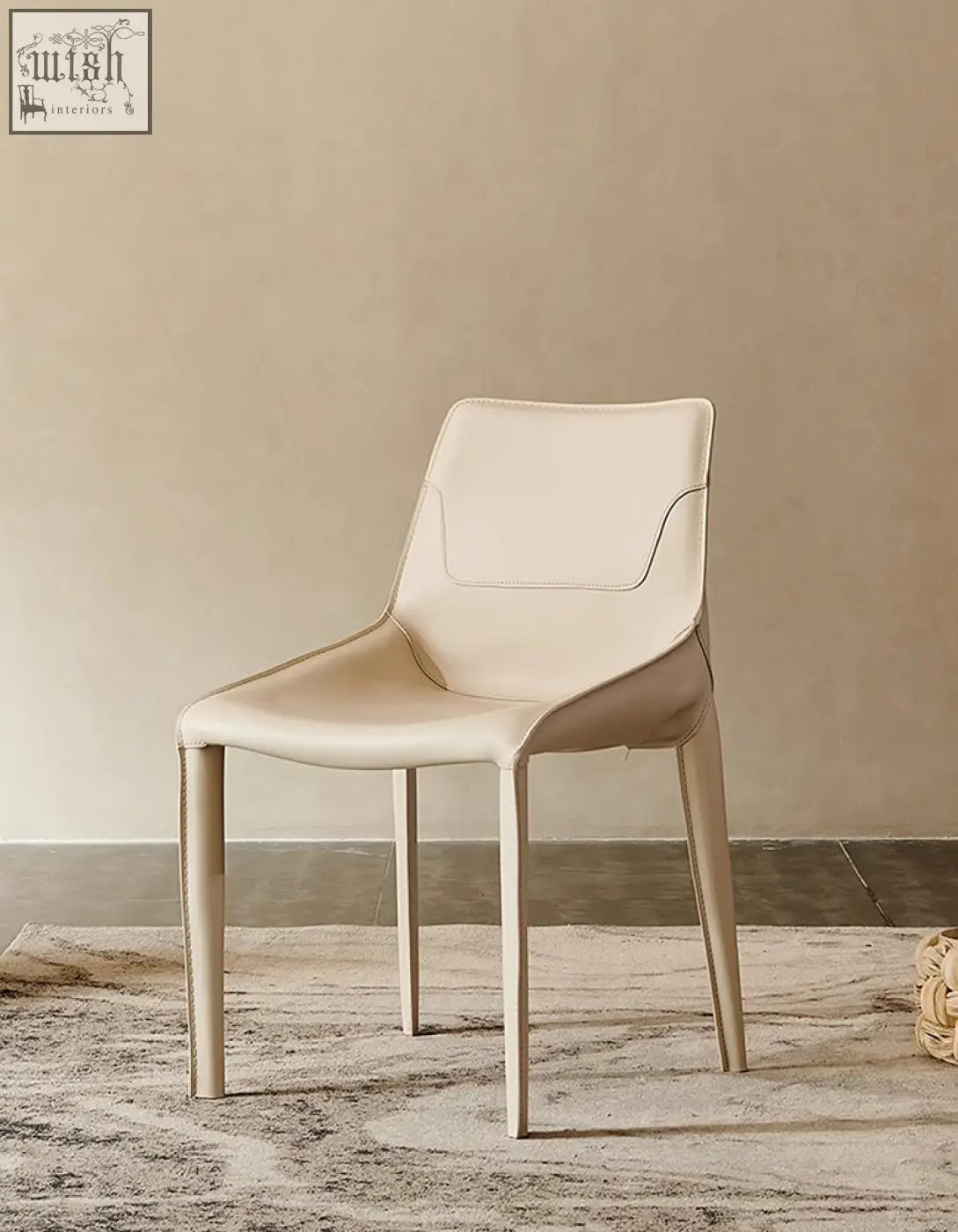 Cream-colored real leather rinaldi modern dining chair with sleek minimalist design perfect for dining room use