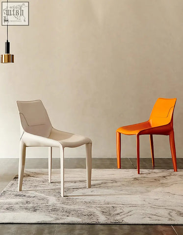 Rinaldi modern dining chairs in white and orange molded plastic with real leather seats perfect for dining room use