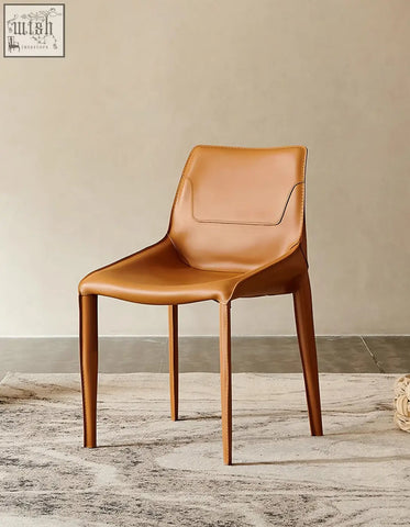 Rinaldi modern dining chair in tan leather with sleek design and tapered wooden legs perfect for dining room chairs