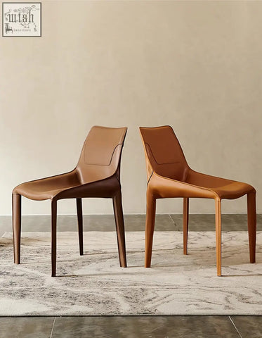 Two rinaldi modern dining chairs in brown real leather with sleek minimalist design perfect for dining room seating