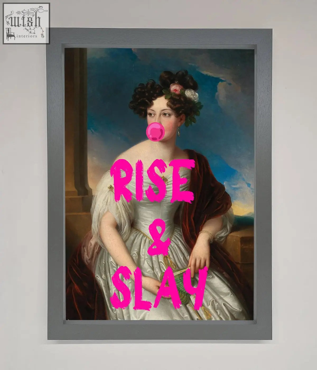 A framed wall art featuring a woman in an ornate white gown with dark hair and a bright pink bubblegum graphic rise and slay