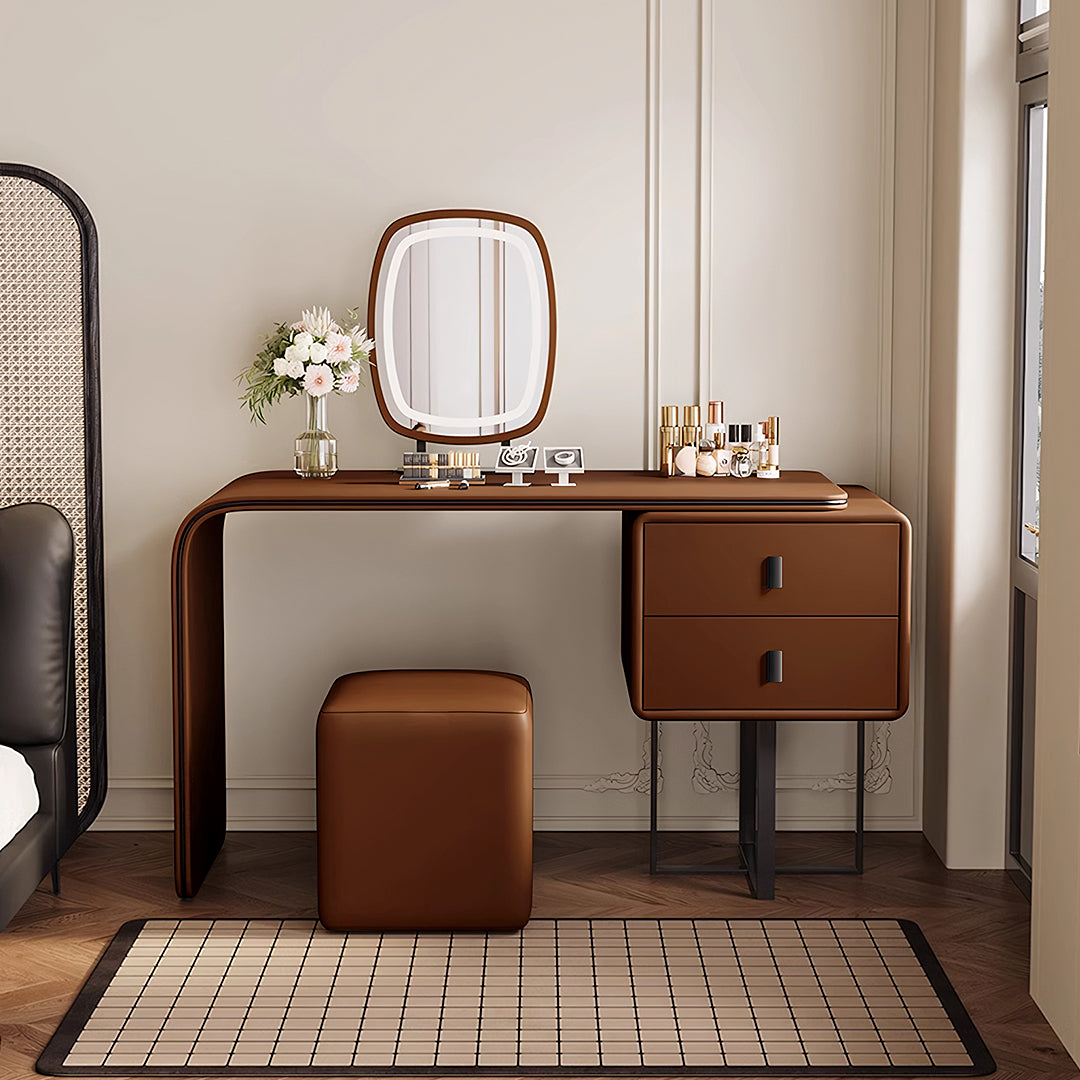Brown leather rivera dressing table with integrated drawers and matching oval mirror mounted above