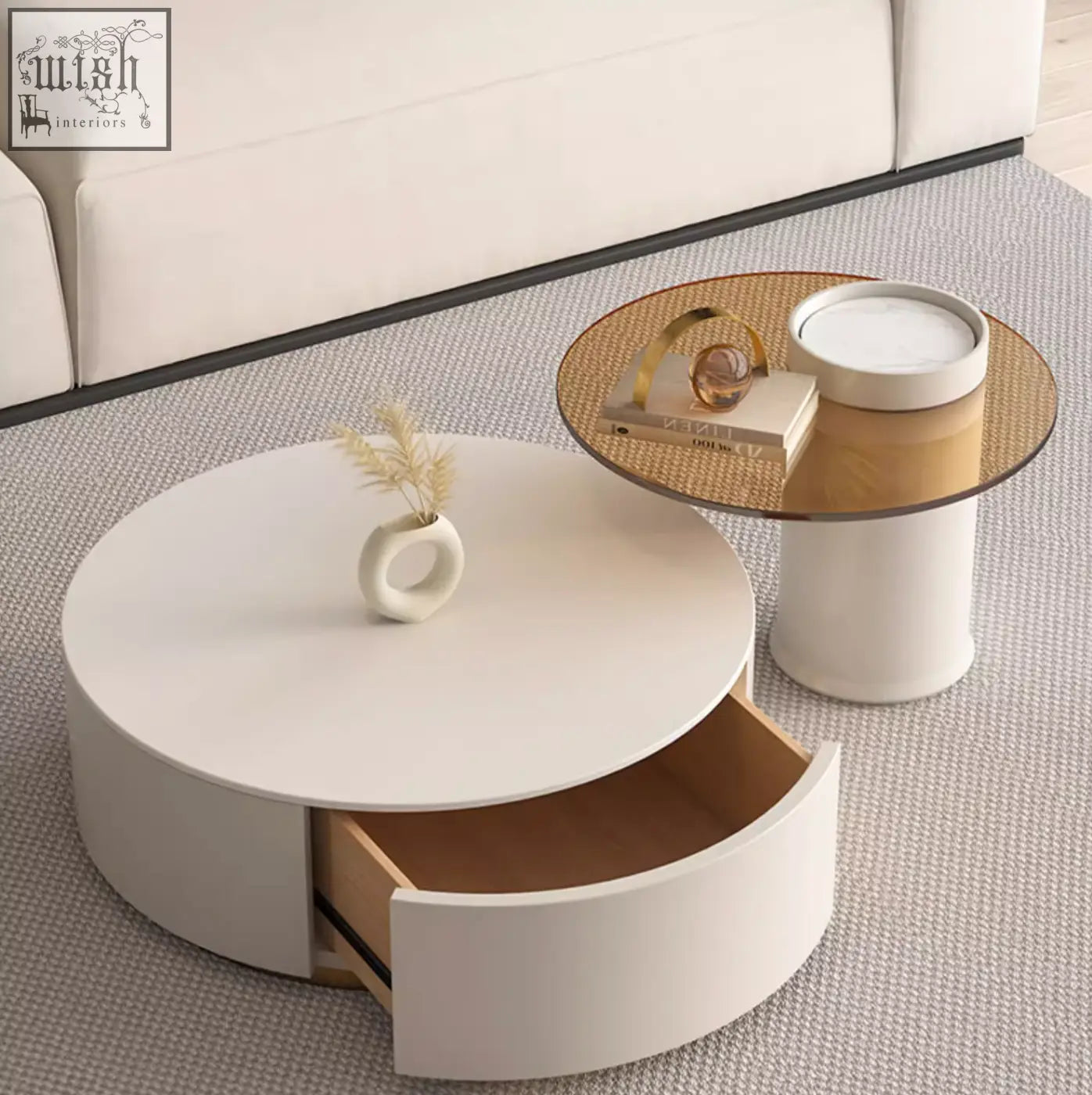 Modern white riviera round nesting coffee table with curved drawer and light wood interior perfect for living rooms