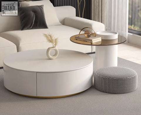 White oval coffee table with gold trim and smooth finish in riviera round nesting round nesting coffee set