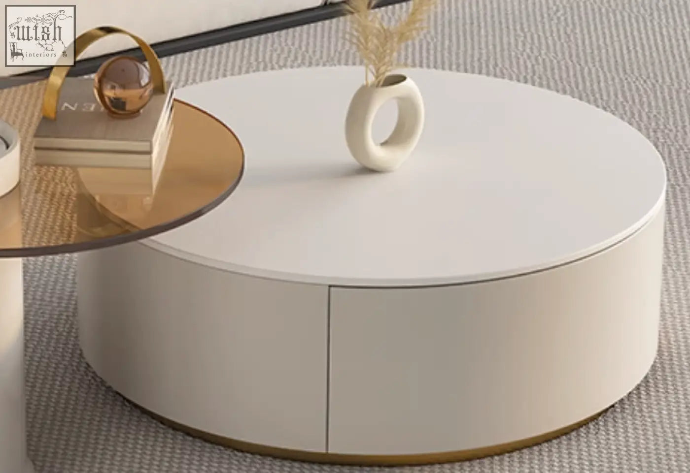 White oval coffee table with smooth glossy finish and gold-trimmed base from riviera round nesting coffee set