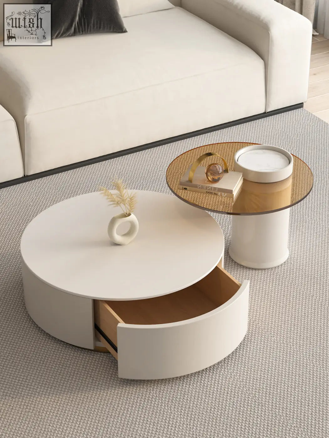 White riviera round nesting coffee table with sleek design and open drawer showing light wood interior