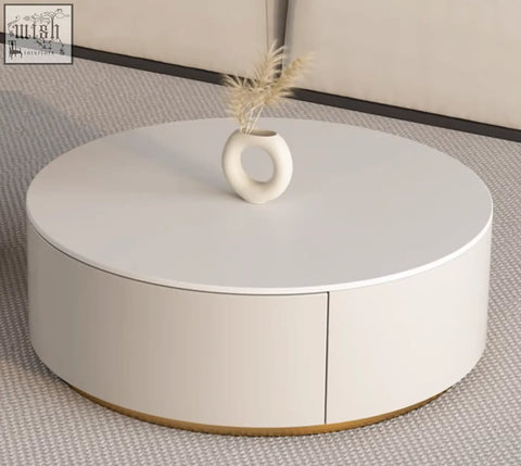 A sleek white round nesting coffee table with minimalist design and gold accents from the riviera round nesting set