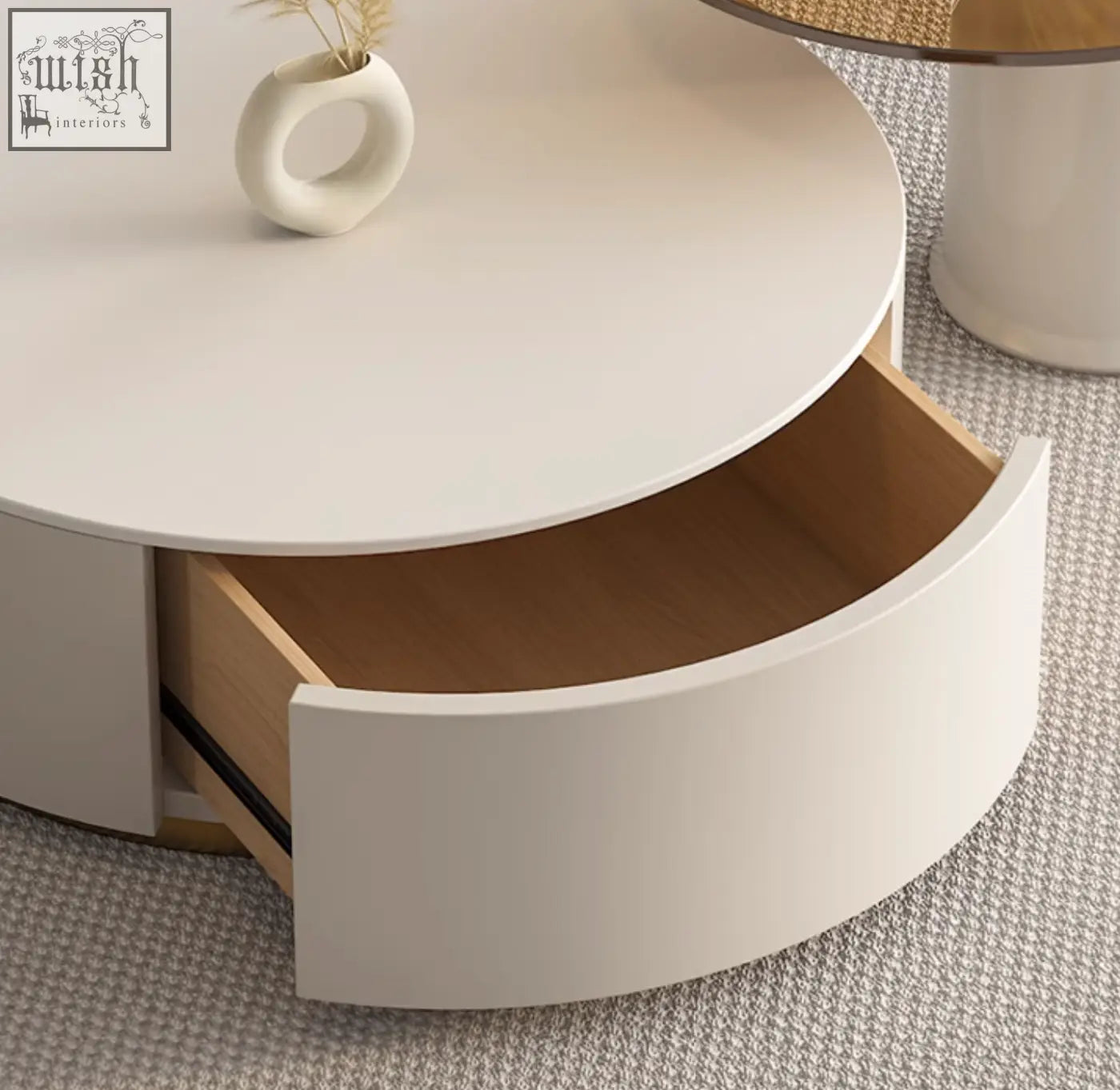 White riviera round nesting coffee table with sleek curved drawer and light wood interior for modern living rooms