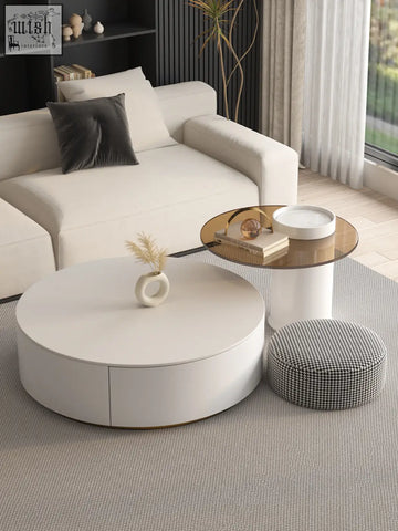 White riviera round nesting coffee table with a smooth minimalist design and subtle drawer detail