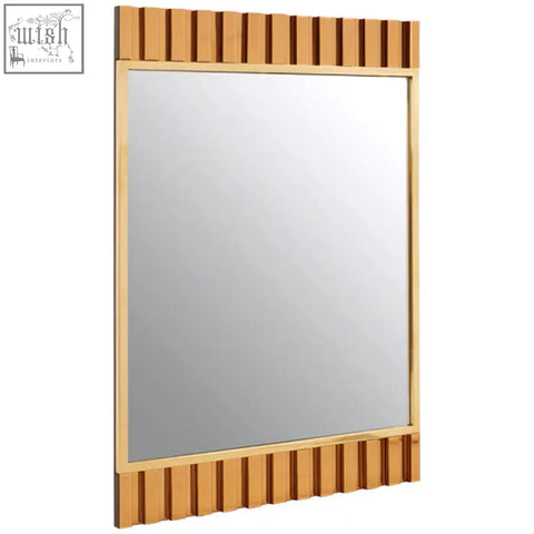 Rivoli wall mirror with gold frame and unique vertical slat design on top and bottom edges perfect gold wall mirror