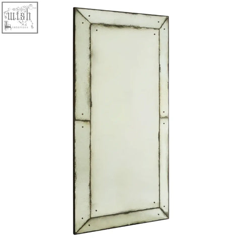 Riza large panelled wall mirror with a distressed silver frame featuring rivets and an aged tarnished finish