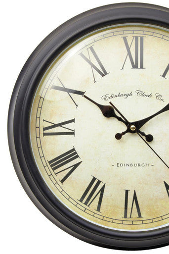 Robello black lined rim wall clock with cream face black roman numerals and Edinburgh Clock Co script design
