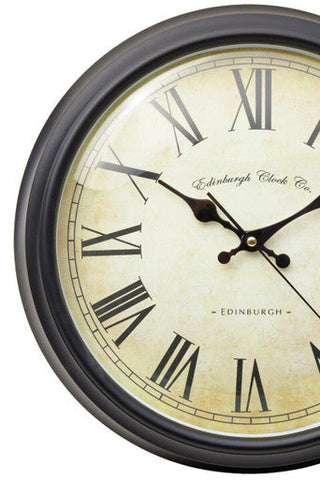 Robello black lined rim wall clock with cream face black roman numerals and Edinburgh Clock Co script design