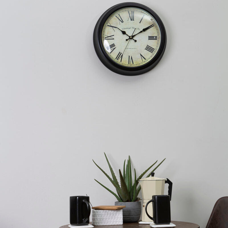 Robello black lined rim wall clock with black-framed round cream face and black roman numerals wall clock