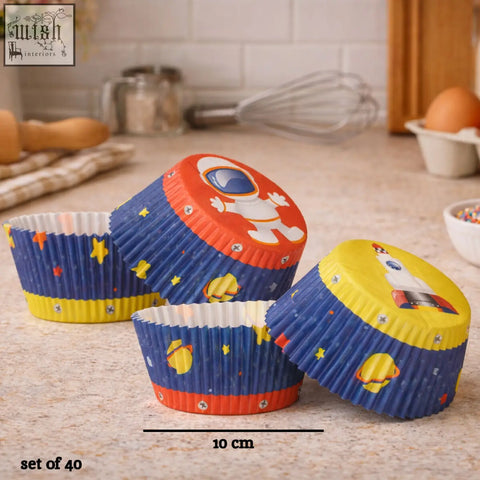 Blue and yellow space-themed large cupcake cases with astronaut and rocket designs for fun big cupcakes