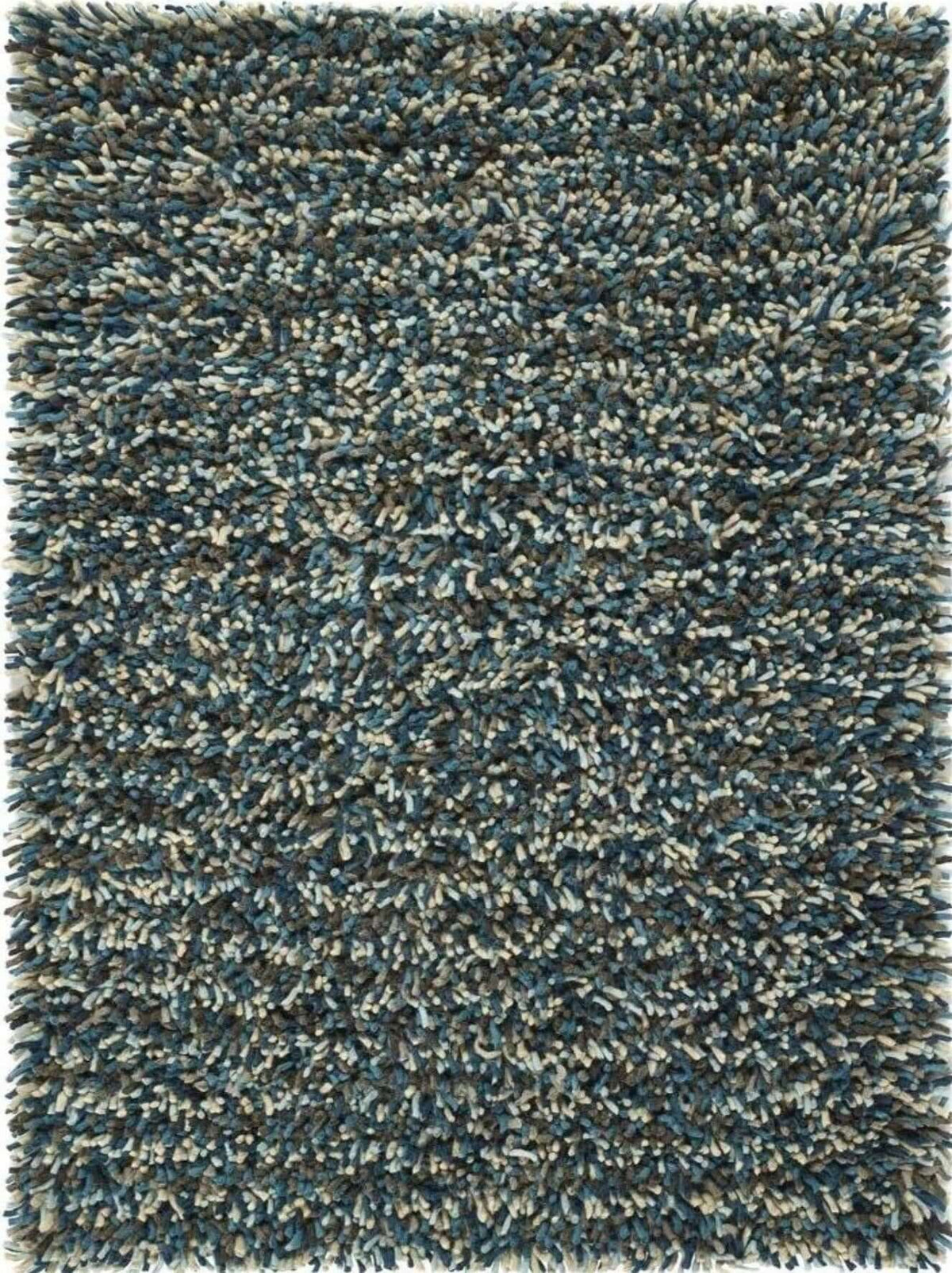 A plush wool rug with shaggy pile and textured surface in deep teal gray and cream called rocks blue shaggy pile wool rug