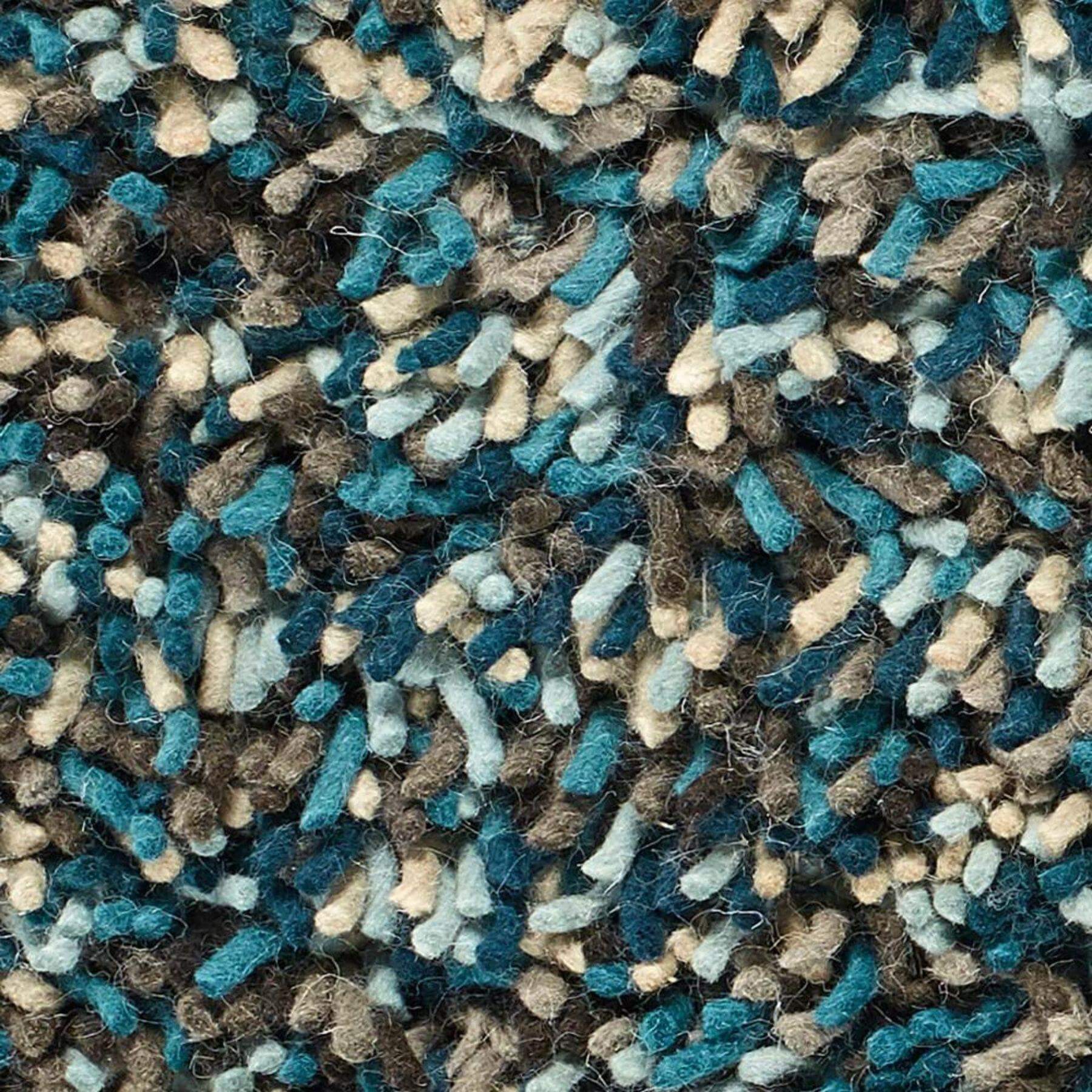 A rocks blue shaggy wool rug with a textured mix of teal beige and brown fibers for cozy living spaces
