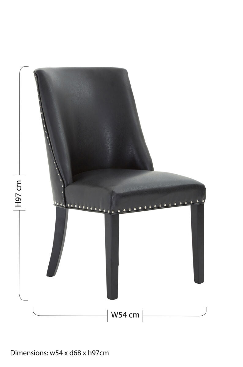 Black leather effect dining chair with studded detailing perfect for rodeo style dining rooms