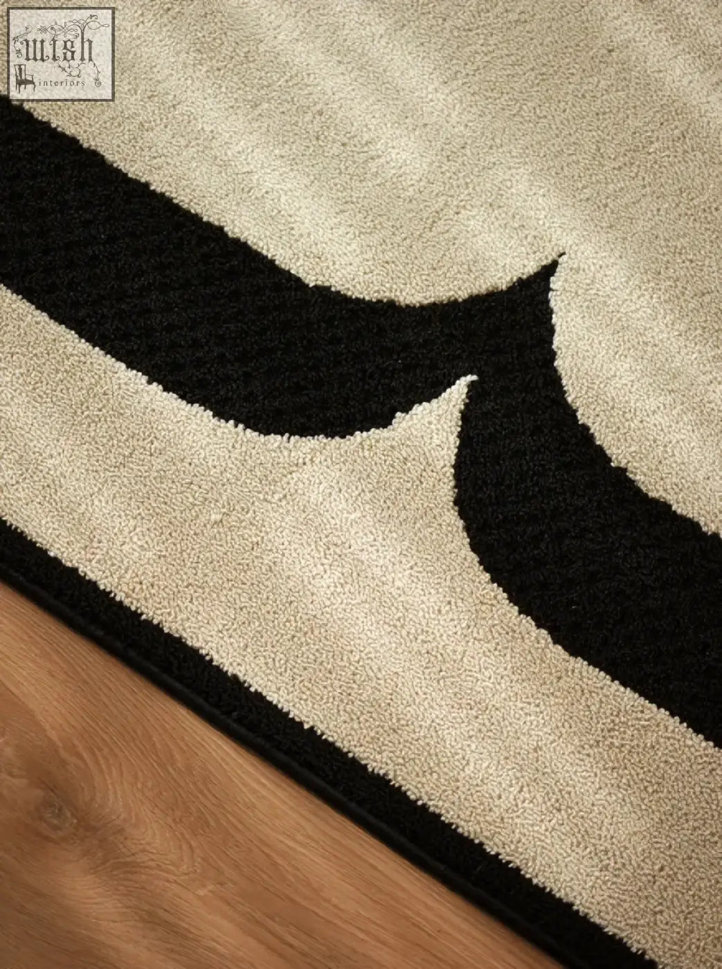 Beige and black abstract patterned rogers rectangular rug with plush high pile perfect for under coffee table set