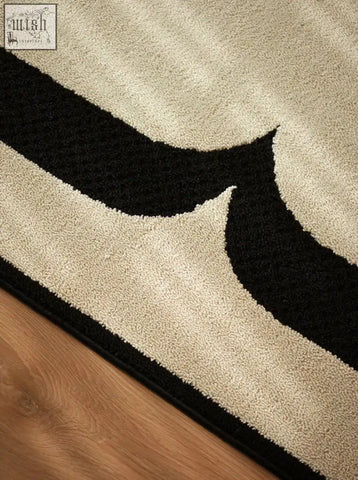 Beige and black abstract patterned rogers rectangular rug with plush high pile perfect for under coffee table set