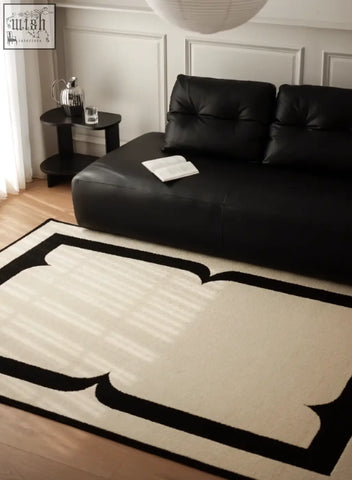 Black and cream rogers rectangular living room rug with bold geometric border perfect for under coffee table set