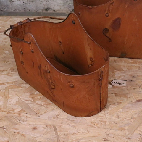 Rustic copper metal magazine holder with curved handle and riveted seams from rohira basket style rusty planters set