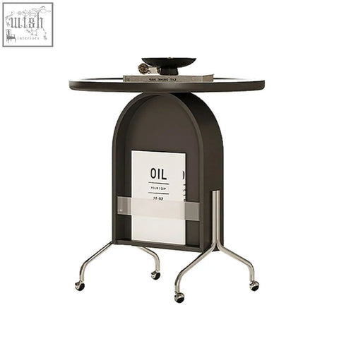 Roland side table in black with piano baking varnish, glass top, chrome legs, wheels, and open book storage