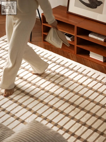 Cream-colored rolland rectangular living room rug with woven grid pattern in beige tones perfect for coffee table set