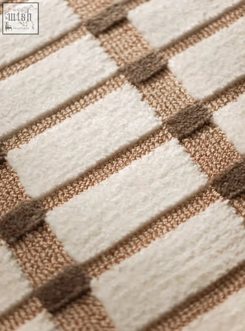 Cream and taupe woven rectangular living room rug with textured grid pattern perfect for coffee table set area