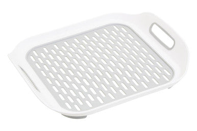 White romm sink mat made of grey plastic with perforated surface and built-in handles for easy use in the sink