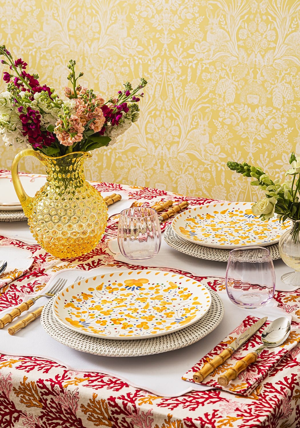 Yellow textured glass pitcher with floral arrangement on rosa pink placemats set of 4 for elegant table decor
